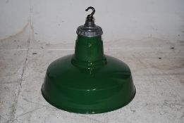 A 1930's vintage Industrial Maxilume enamel pendant hanging lampshade. Green enamel to outside,
