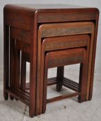 A 1930's Chinese quartetto nest of tables. The arch shaped tops over squared legs united by