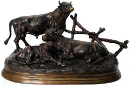 A BRONZE GROUP of Cattle, after Jules Moigniez, comprising bull, cow and calf near a fence,