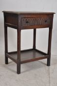 An early 20th century ipswitch oak Jacobean revival oak side table. The squared legs with