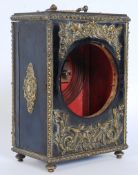 A 19th century ebonised wood and brass decorated mantel clock case, standing on worked feet. With