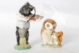 A Beswick figure of Daniel (PP5 - violin playing pig) and a Beswick Beatrix Potter figurine of Old