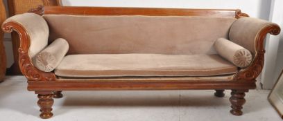 A 19th century Regency / William IV mahogany scroll end large chesterfield sofa. Raised on block