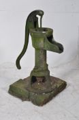 A Deming Co, Saleml, Ohio cast iron water well pump with handle to rear, spout to front affixed to