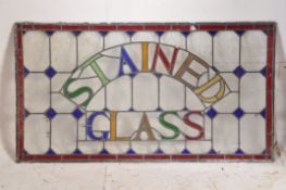 A large 19th century stained glass window pane being of leaded construction bearing arched notation