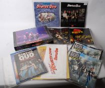 A sealed Status Quo 1000 piece jigsaw puzzle along several tour programmes, magazines and posters