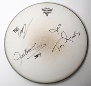 AUTOGRAPHS: A Remo Drum skin signed by Tori Amos and band in black marker to front, and dated 2009.