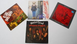 A collection of 35rpm vinyl record singles to include Motorhead Iron Fist, Strange Held, UK Subs