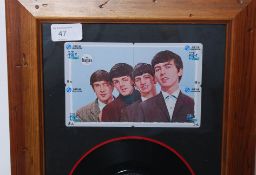 A framed and glazed 7`` vinyl record single of The Beatles first pressing of She Loves You matrix