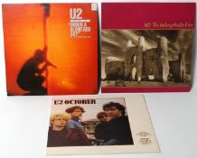 A collection of U2 vinyl LP records to include October, Unforgettable Fire and Blood Under A Red