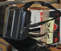 A retro cased Sharp video camera complete with tripod, video lamp, boom microphone etc.