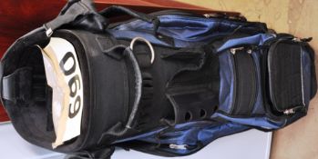 An unused golf bag in blue and black