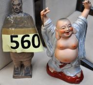 A china figure of Buddha, along with a Japanese oriental pottery soldier figure.