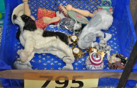 A mixed lot of items to include a china shoe and handbag, animal figurines, small brass clocks and