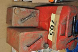 Three industrial style painted petrol cans, one being a Jerry can.