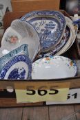 A mixed lot of plates to include a 19th century willow pattern meat plate and others.