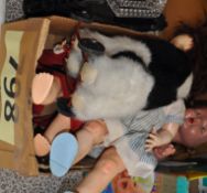 A mixed box to include 3 dolls, a Merrythought stuffed dog on wheels and other items.