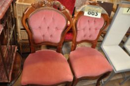 A pair of pink velour reproduction mahogany dining chairs