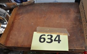 A wooden box containing Meccano.
