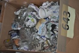 A box of assorted glass wares and china items.