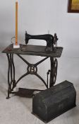 A Victorian Bradbury cast iron sewing table complete with sewing machine and cover stamped `B`