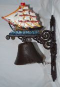 A 20th century doorbell in the form of a sailboat, made of cast metal with hand painted detail to