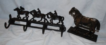 A cast metal equestrian themed horse hanging coat rack, along with a bronze effect cast metal horse