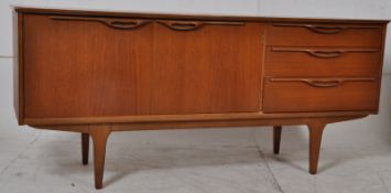 A 1970`s Danish teak wood retro low sideboard dresser. Raised on tapered legs with a bank of