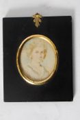 An antique 19th century miniature oil painting on ivory slither in original ebonised frame, with