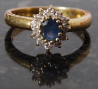 An 18ct gold sapphire and diamond ring, size M.