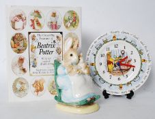 A Beatrix Potter Mrs Rabbit and babaies money box with original box, along with ` The Great Big