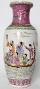 A decorative chinese oriental vase with hand painted river / boating scene to front, with a pink