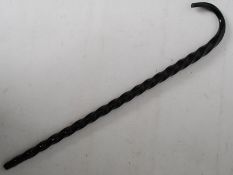 A black nailsea glass spiral twist walking stick (af)