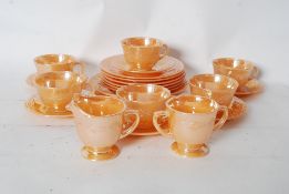 A part tea service / collection of carnival lustre glass to include, cups, plates and saucers etc