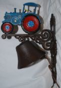 A 20th century cast metal doorbell in the form of a blue farming tractor, with hand painted detail