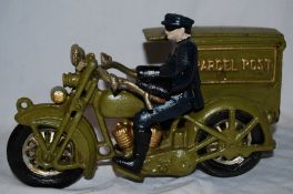 A vintage American style cast metal Parcel Post motorcycle figure.