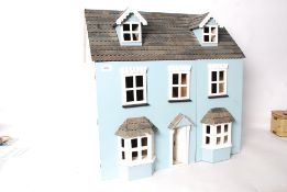 A childs dolls house together with a quantity of furniture etc ( see illustration)