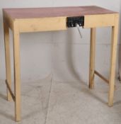 A vintage 1950`s painted formica ( red ) table workbench. The painted base with red formica top