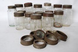 A collection of vintage 20th century kilner jars of varying sizes complete with glass lids and