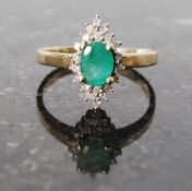 9ct gold diamond cluster ring with green stone, possibly an  emerald. size P.
