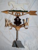 A 20th century hand painted cast metal weather vane in the form of a horse.