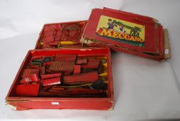 A collection of vintage meccano complete in the original boxes with paper labels  (See
