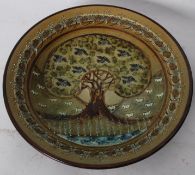 A studio pottery majolica glazed charger bowl of abstract design. Signed illegibly to base