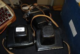 2 Zenit E cameras together with a Zenit X1 complete with leather carry cases to each along with a