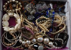 A collection of costume jewellery to include necklaces, bracelets etc.