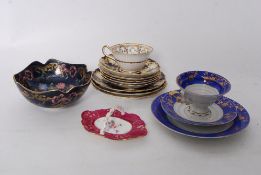 A collection of 19th century and later ceramics to include hand decorated plates and saucers