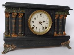 An American Sessions faux marble and slate columned mantel clock, with key and pendulum.