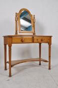 A Ducal pine dressing table with a swivel mirror. H74cm x W98cm x D48cm.