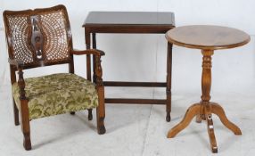 A bergere chair, circa 1920`s together with an oak ocassional table and a light wood circular lamp