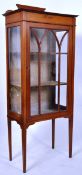 An Edwardian mahogany inlaid display cabinet. The square tapered legs supporting an upright cabinet